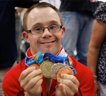 Gallery Image Athlete_showing_medals_off.jpg
