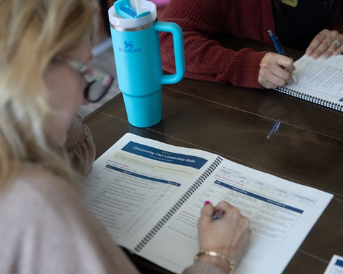Founding Mentor Cindy Dipuma works through the “Discovering Your Leadership Style” exercise in her Participant Workbook