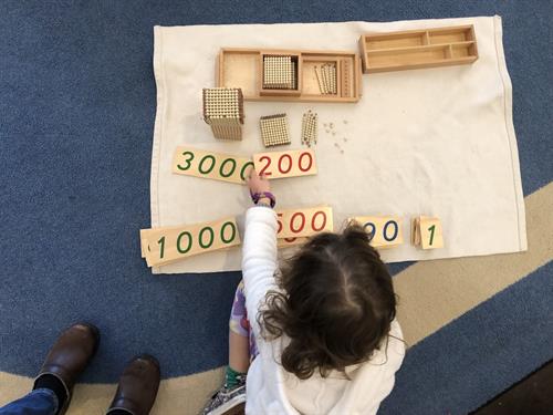 Kindergarten student building quantities in the 1000s.