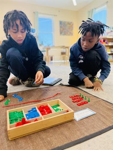 5th grade boys practicing long division. 