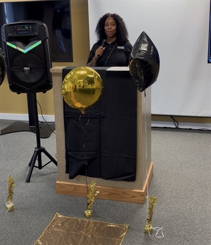 Victoria M. Harris, Founder & CEO of From Convict to Corporate Inc., addressing graduates and guests during a program milestone celebration.