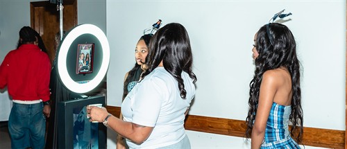 iPad photo booth setup at a high school graduation party.