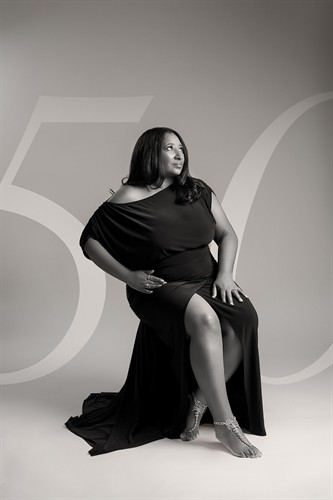 Black-and-white portrait celebrating a 50th birthday.