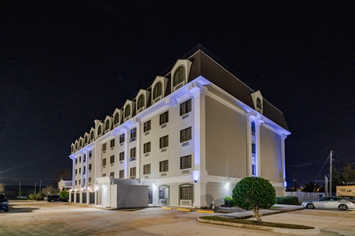 Best Western hotel photographed at night from the rear exterior.