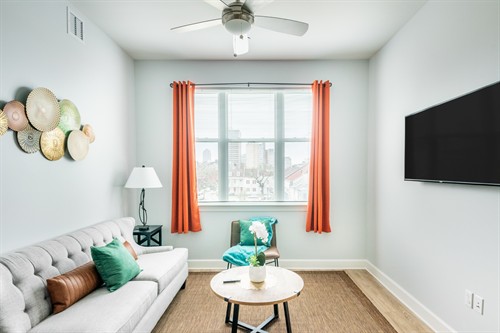 Interior photograph of an Airbnb rental living room in New Orleans.