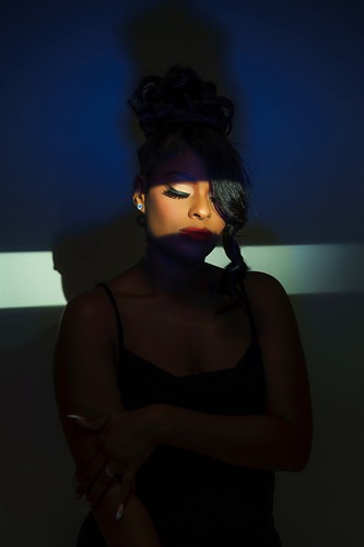 Creative studio portrait using dramatic professional lighting.