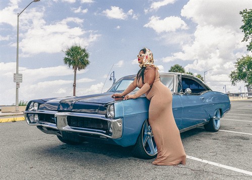 30th birthday portrait session with a vintage car along Lake Pontchartrain.