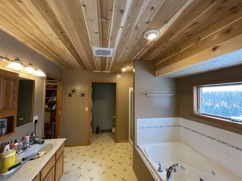 We do Interior as well!! Cedar Planks on a bathroom ceiling makes for a moisture ready warm bathroom.