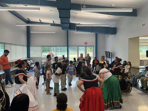 Latinos Activate JOCO Recuerdos de mi Tierra. Memories of my land. Folkloric dancers did performing for and teaching to dance the My Kid's Club club members.