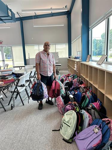 Latinos Activate JOCO Partners with Thales Academy to donate 92 stuffed back packs to My Kid's Club 2024