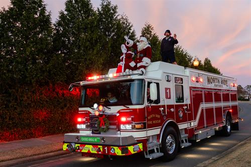 North Side Fire & Rescue bringing Santa and Mrs. Claus to the Tree Lighting