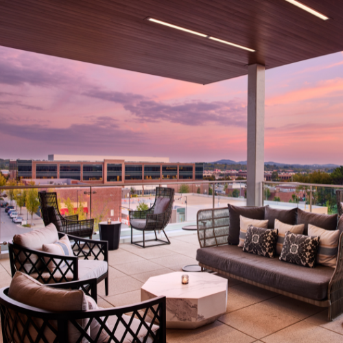 Rooftop lounge serving handcrafted cocktails and appetizers with scenic views of Hill Center.