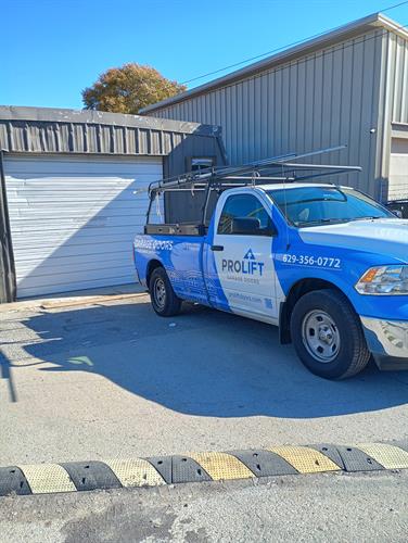 Commercial garage door repair completed today in Nashville. Reattached hinges, replaced a worn roller, and restored safe, smooth operation.
