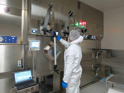 Production technologist manufacturing imaging agent for hospital