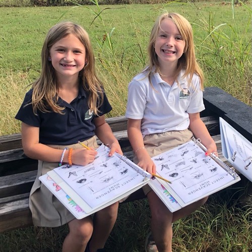 Students explore nature in the Monarch Garden.