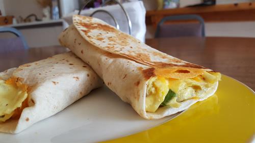 KS Breakfast Wrap: 3 scrambled Eggs, Sailer's Breakfast Sauasge, Onions, Peppers, Eau Galle Cheese Factory's Sharp Cheddar all wrapped up in grilled tortilla.