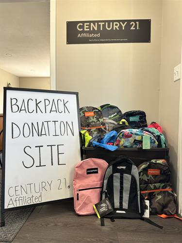 Collecting backpacks for the students of the Menomonie Area.