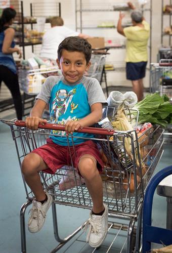 In our program Feeding Families, families with children can fill a whole grocery cart with fresh produce and other items free of charge.
