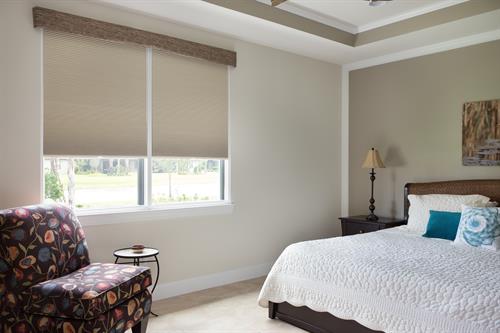 In this master bedroom, we mounted two room darkening Norman Decoflex shades together to provide a darker and more comfortable place to rest.