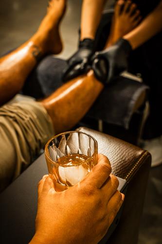 Pedicure with an icy beverage