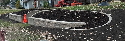 Spicer, MN project - Block retaining wall and mulch bed landscaping.