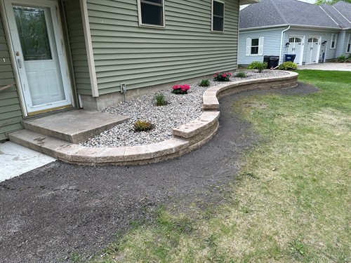 Benson, MN project - Block retaining wall and landscaping around house.