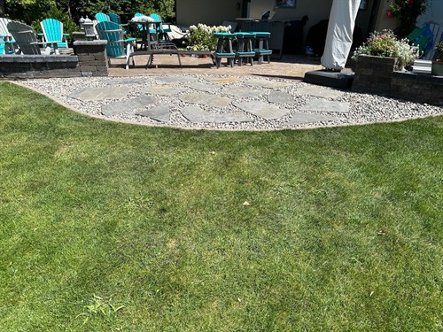 Spicer, MN project - Flagstone transition from patio to grass.