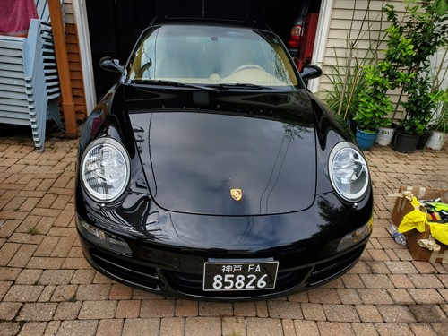 Headlight polishing on a Porsche 911, right in the driveway — Skokie, IL, our home base.