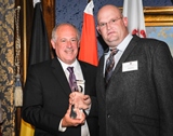 Jacob Cluver, CEO of Ag World Intl, receiving the Governor's Agricultural Business Exporter of the Year 2013