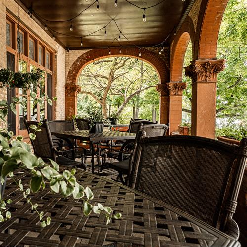 The west side porch is perfect for a summer breakfast, a glass of wine or outdoor event.