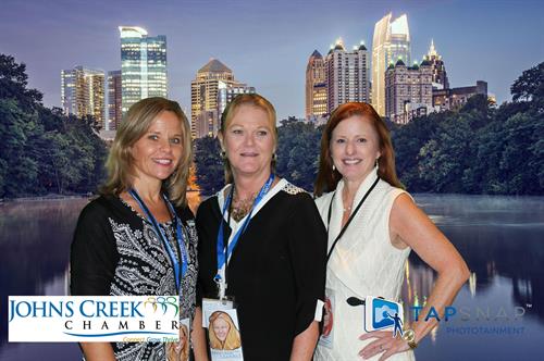 JCC Business Expo with Atlanta green screen background and branding