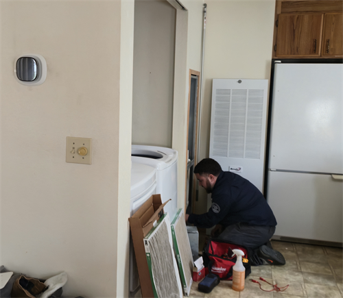 One of our certified technicians troubleshooting a heat pump conversion for a new customer