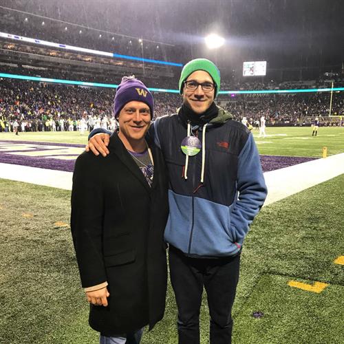 Kyle and Troy down on the field at a Washington Huskies game.