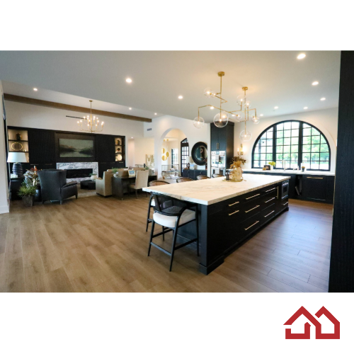 Modern, open-concept living space blends warmth with refined sophistication. Custom dark accent wall cabinetry anchors the room, featuring a sleek fireplace, built-in shelving, and an integrated art television above the mantel.