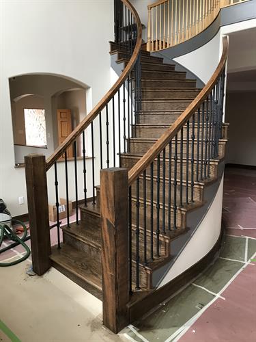 Curved handrail with iron balusters