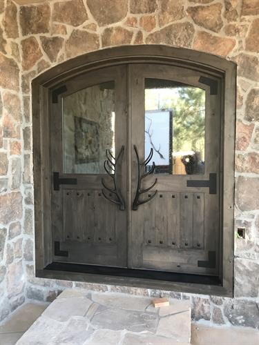 Custom front door with seeded glass and metal onlay
