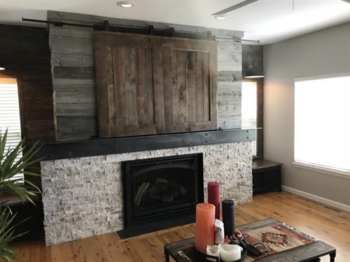 Steel mantle and reclaimed wood entertainment center