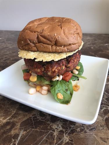 Sun-dried Tomato Burger made with fresh Organic ingredients! The Burger is topped with a Garlic-Parmesan Crisp.