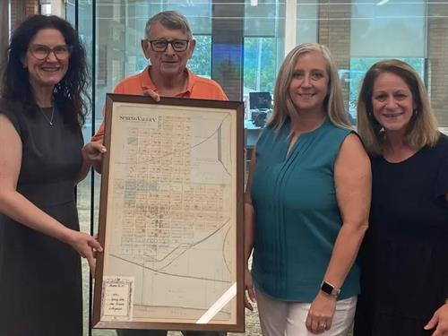 Preserving our town’s rich history is important to both SVCB and to the SV Historic Association. Pictured from left, Heather Hammitt of SVCB presents Tony Mautino with an 1892 plat of the town of Spring Valley for use by the SV Historical Museum. Also pictured are Tracy Cruz and Julie Eilers of SVCB. We are honored to share this important piece of our past with the Museum