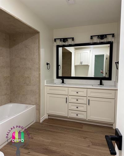 Custom made vanity for master bath, new lighting and upgraded floors