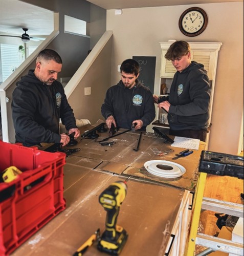 Johnson Electrical Services team preparing electrical equipment for a residential installation project in Skagit County, WA.
