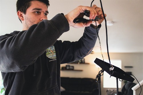 Residential electrician performing electrical wiring and lighting installation for a home improvement project in Skagit County.