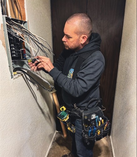 Licensed electrician performing electrical panel troubleshooting and repair to ensure safe and reliable power for homeowners.