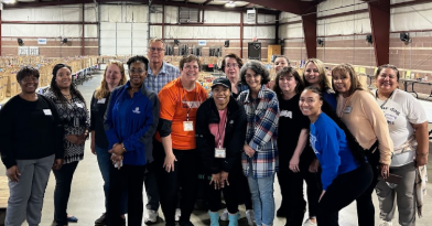 CCHASM packing meal bags with valued volunteers