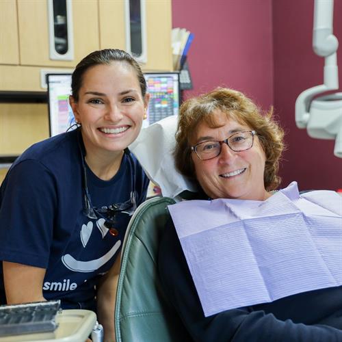 Our Hygienist Morgan smiling with a patient from Dentistry from the Heart! 