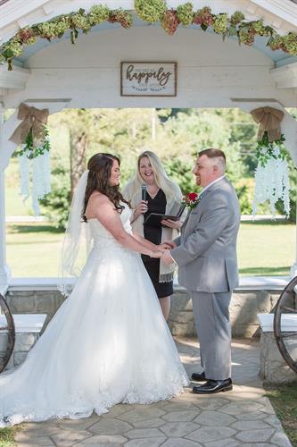 Becky sharing a funny moment with John and Krista during their ceremony. Moodus, CT Photo by Jessica Parsons Photography