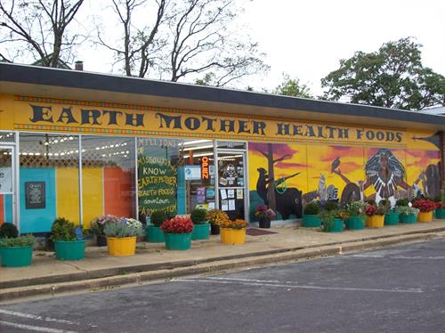 Front of Earth Mother with herbs in bloom