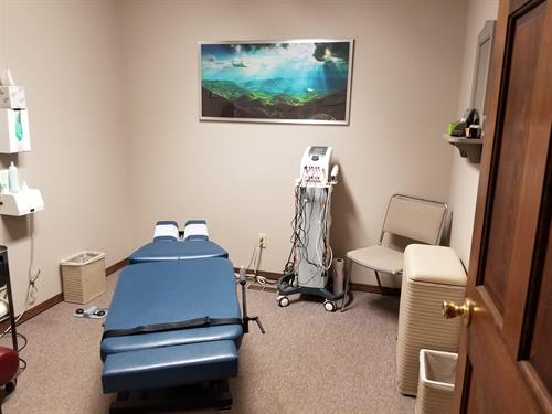 Treatment room 1 (Cox Flexion/Distraction Technique, Class IV Laser Therapy, & Electrotherapy)