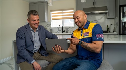 Wish Granted Plumbing professionals explaining options to the customer. 