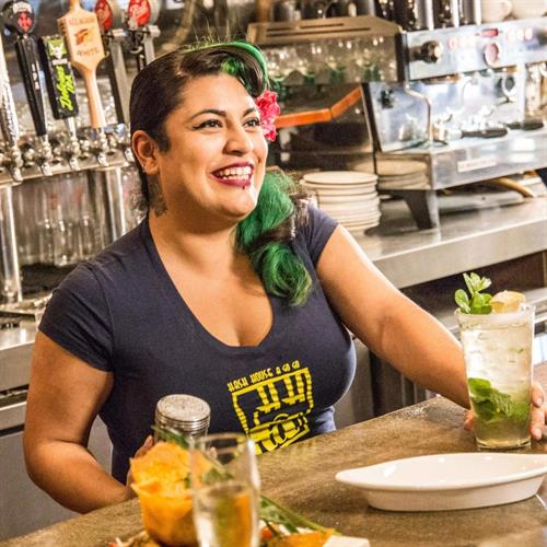 Gallery Image hash-house-smiling-bartender-with-drink-1300x1300-c_-_Copy.jpg